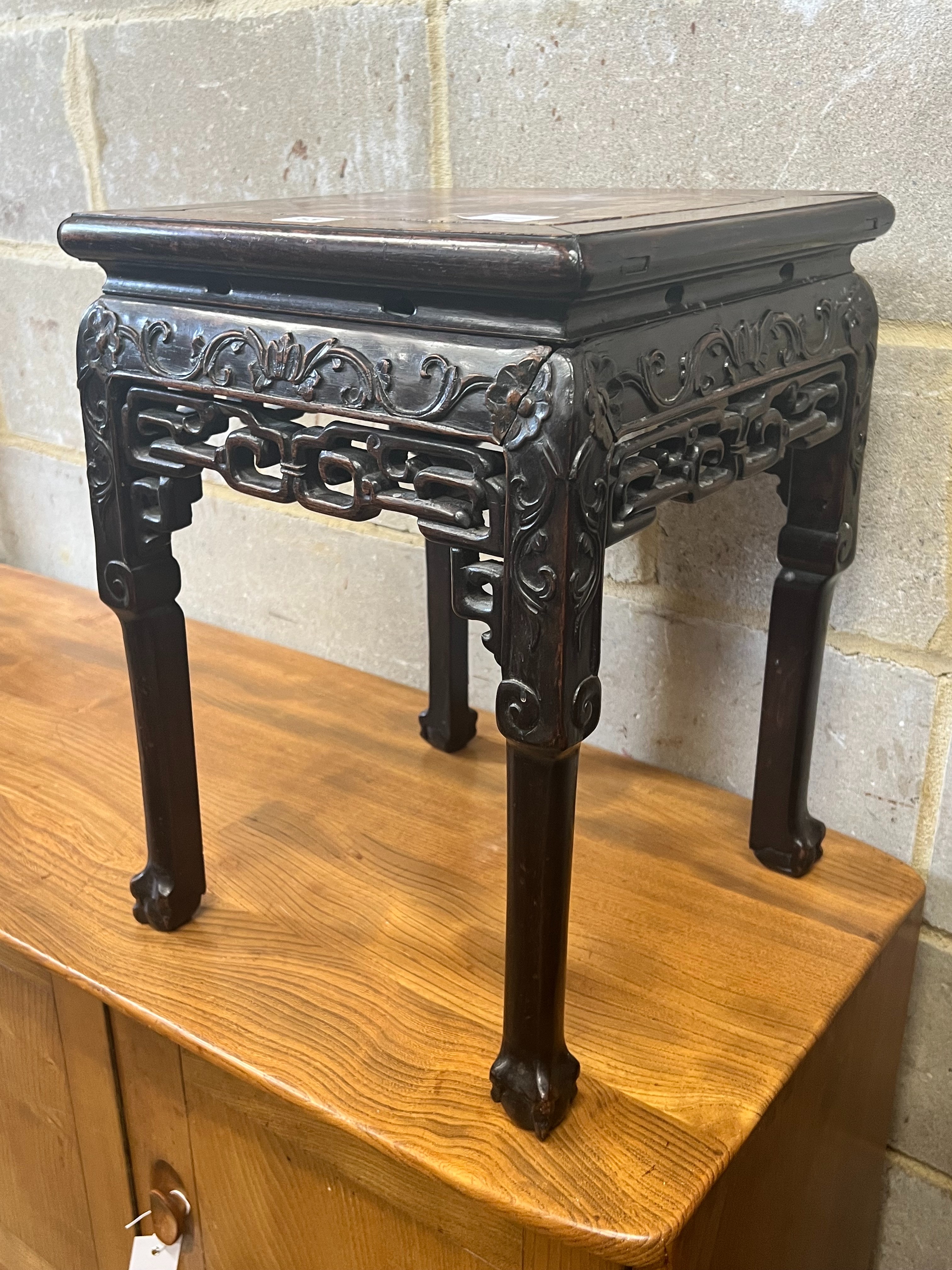 A Chinese marble topped carved hardwood jardiniere stand, width 35cm depth 35cm height 47cm